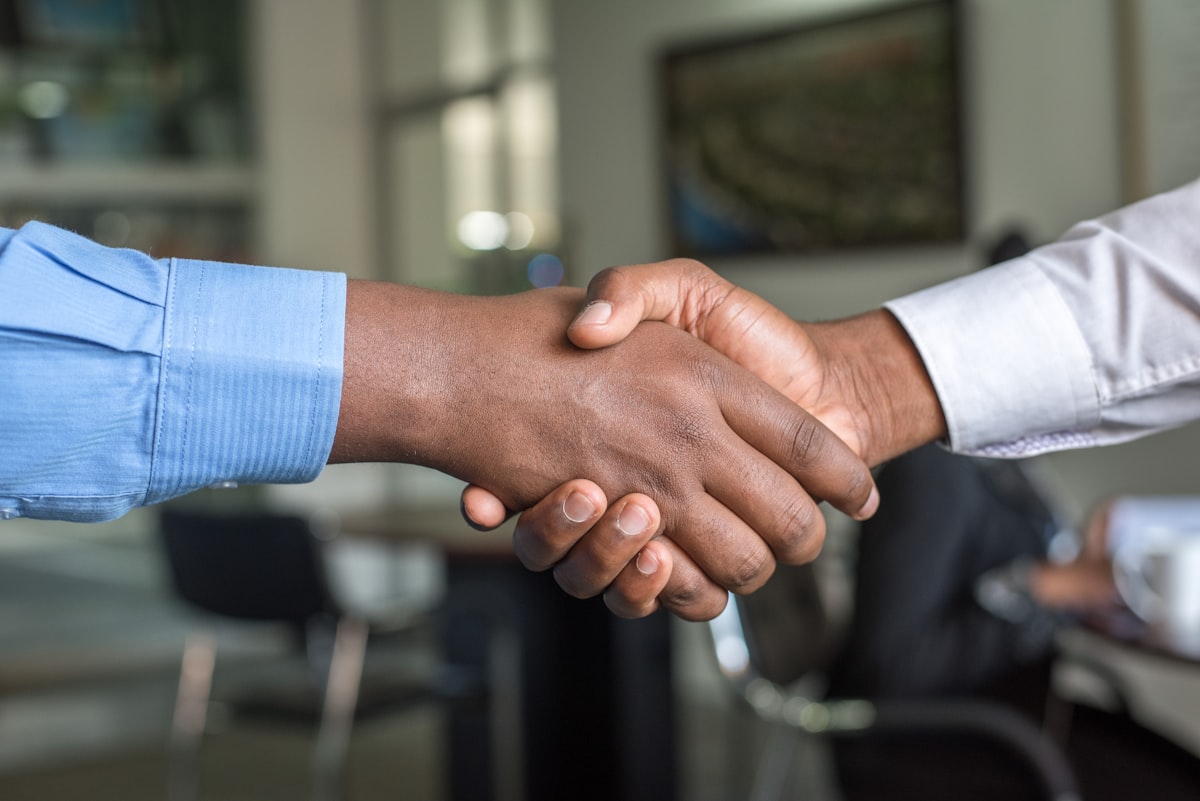 Professional handshake representing trust and partnership